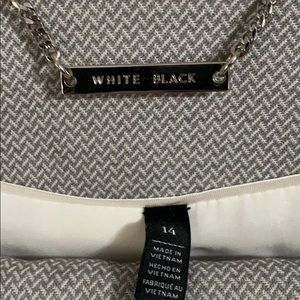 Grey and white skirt suit.